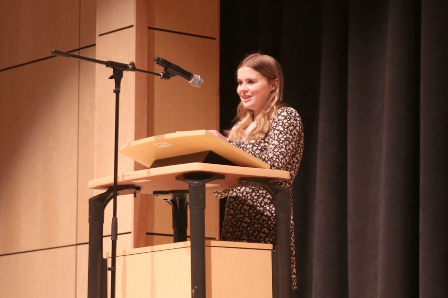 In front of the crowd of the inductees and their families, NEHS president senior Helen Springer gives a speech to welcome the new members during their induction Thursday, Jan. 26. 
