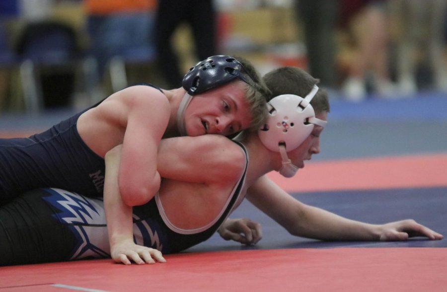 Freshman Jeredy Nilges pins his opponent on the mat.