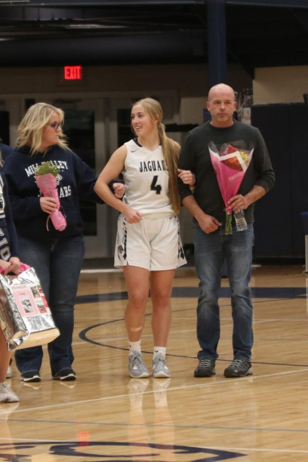 Smiling at her mom, senior Aliyah Cloughley is recognized as a basketball senior.