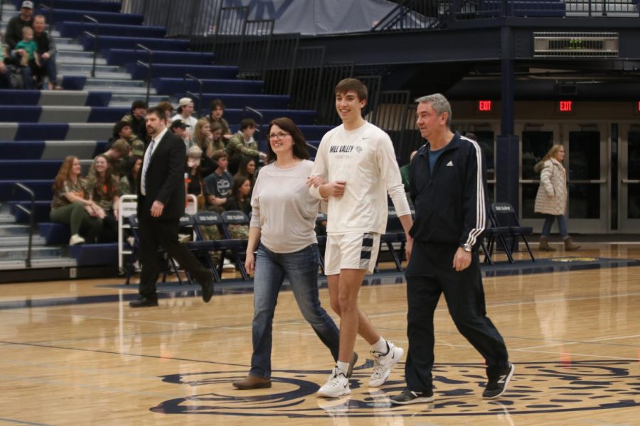 Smiling at the crowd, senior Marco Skavo is recognized.