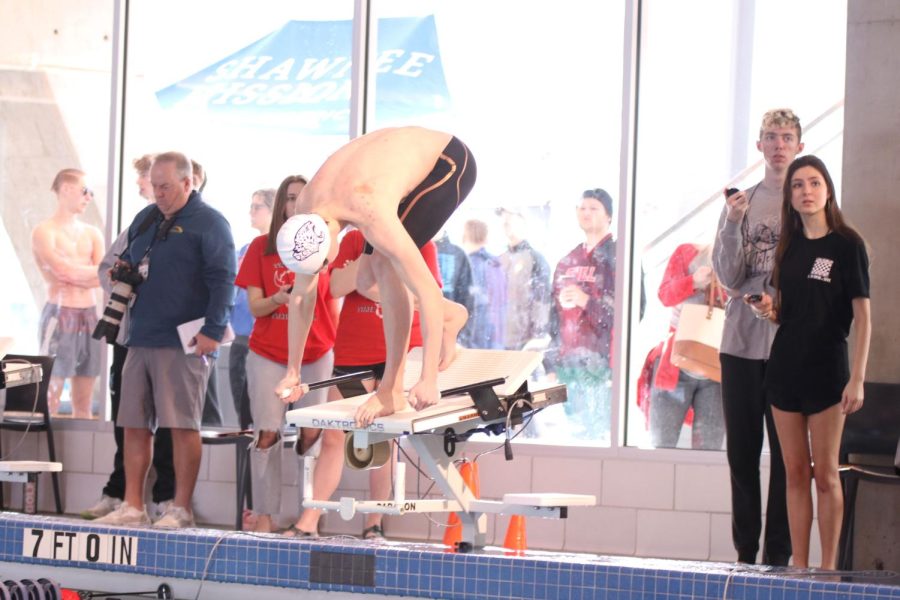 Standing in the set position, senior Dylan Miller waits for the race to start.