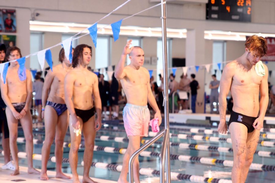 As his name is called, junior Max Roh raises his hand before the diving finals.