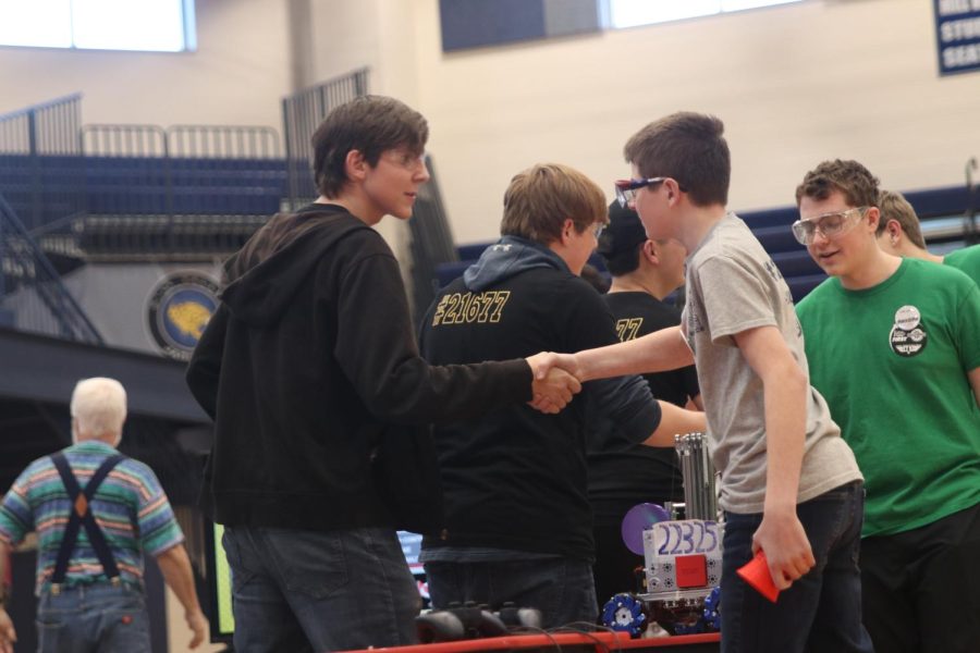 Senior Garrett Cowen shakes his opponents hand after winning the championship.