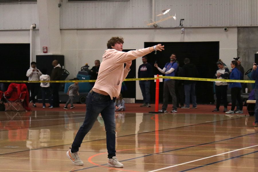 Leaning into a throw, sophomore Carter Tollman launches his plane in the Flight competition.
