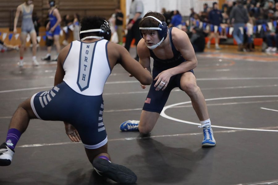 Junior Dylan Cooper faces his opponent and begins to move in. 