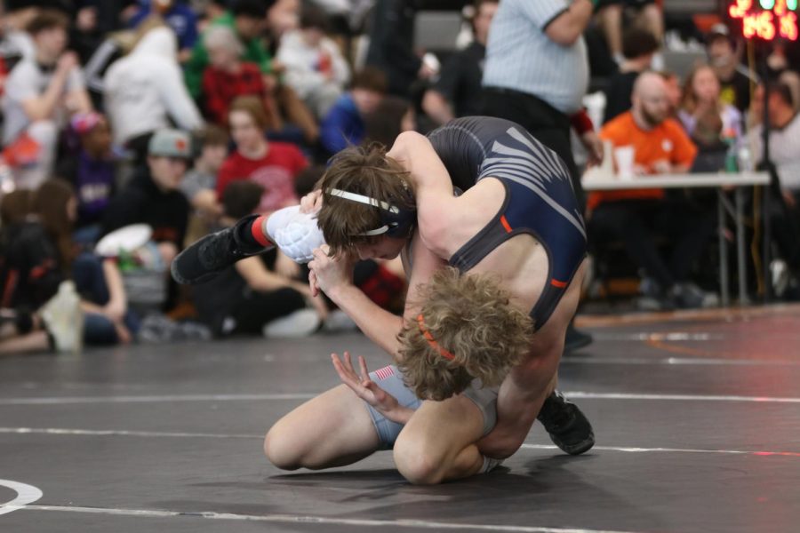 Freshman Jacob Reitz picks up his opponent.