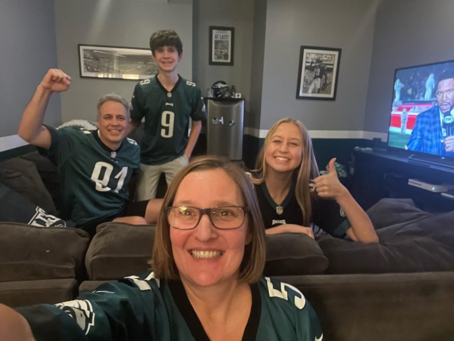 Showing off their team spirit, sophomore Maggie Wieland and her family poses for a selfie before the beginning of the Super Bowl game. 