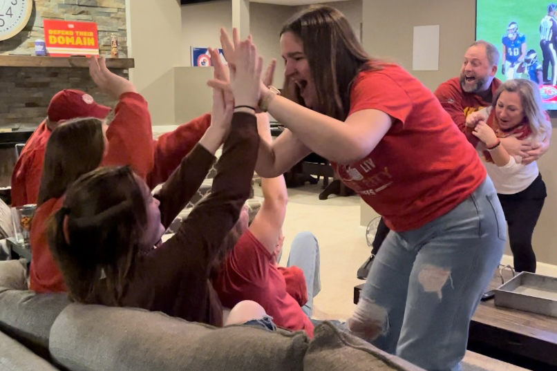 Celebrating the Chiefs touchdown, junior Lauren Prestia high fives her friend. 