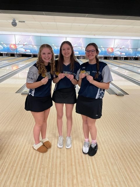 Standing together with their medals, freshmen Abby Haney and Layla Gonzalez and junior Kiara Gonzalez are ecstatic about their performance at regionals after all three of them placed in the top eight individually. 
