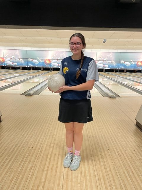 Junior Kiara Gonzalez smiles big after her individual first place win at regionals, where she broke the school record for single series high score at 277 and high score overall of 737.