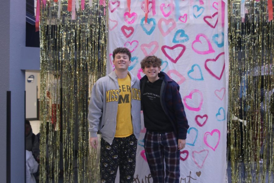 Standing in their best PJs, juniors Ethan Brownfield and Corbin Garnand smile for a picture.