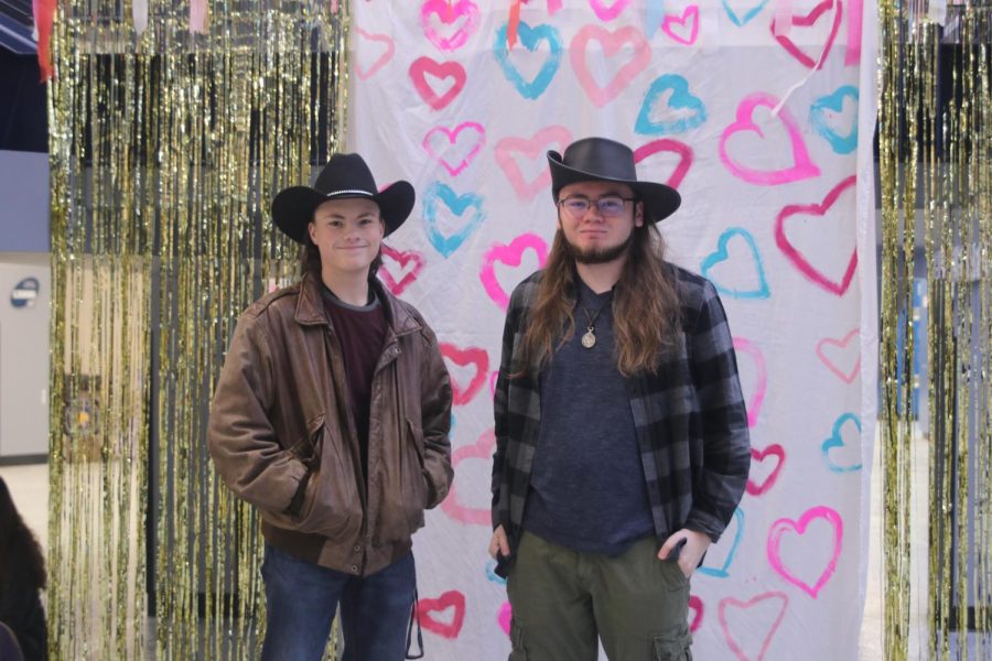 Hands in pockets, juniors Greyson Bruce and Aiden Furgeuson pose in their cowboy hats.