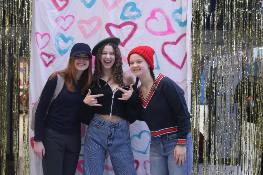 Showing off their best hats, juniors Ashley Makalous, Sophia Estes and senior Cassie Frias pose for a photo.