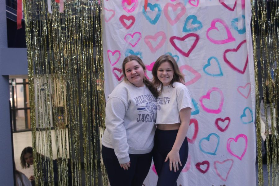 Smiling at the camera, juniors Kate Haney and Caroline Alley show off their jaguar spirit.