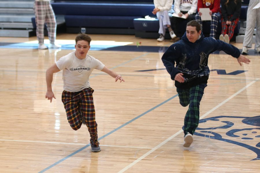 Seniors Jameson Beran and Foster Jonasson race to get the rose. 