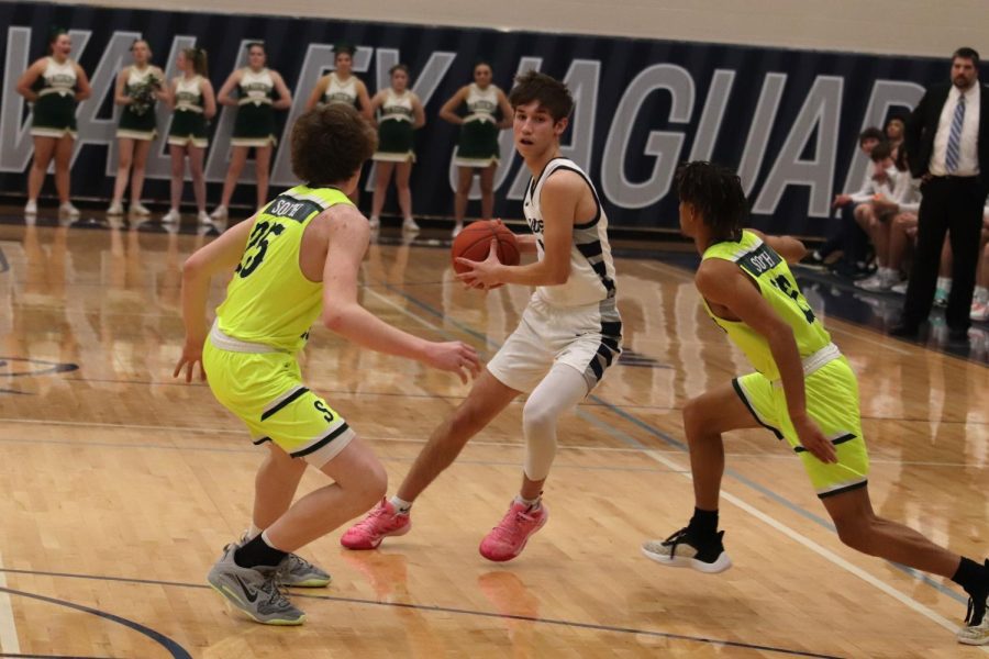 Looking for a hole, senior Brooks Jahnke tries to get closer to the net. 