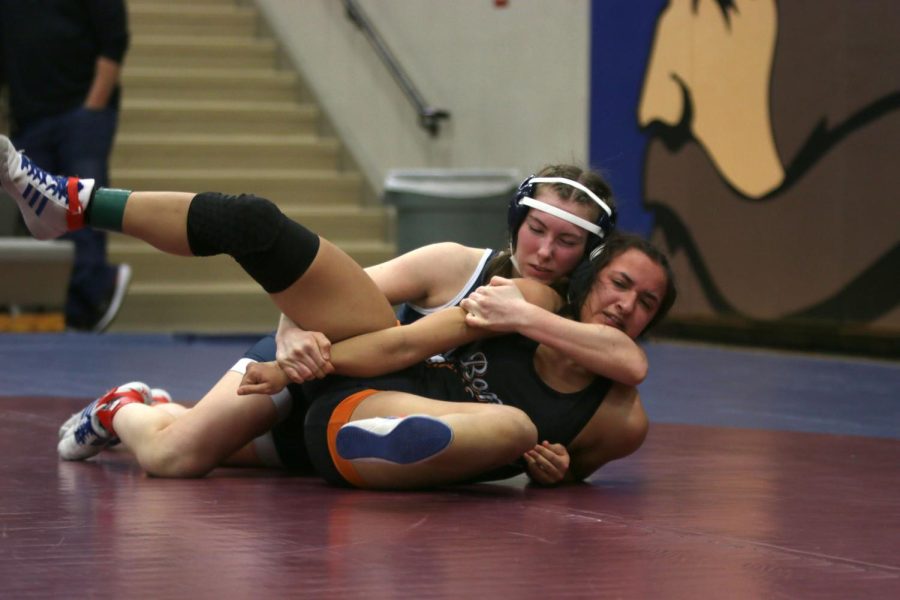 Swiftly, Piper Wendler tries to restrain her opponent