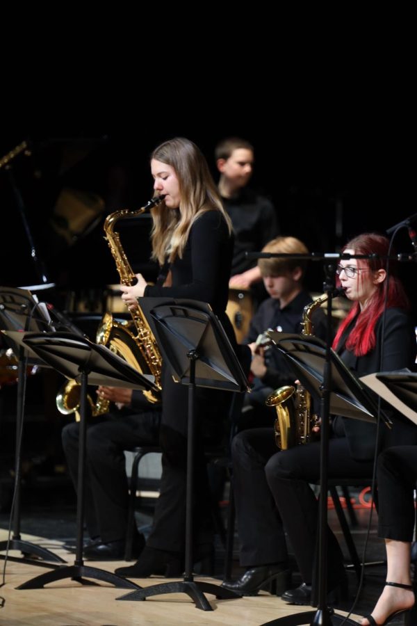 Performing her solo, senior Sienna Delborell plays the saxophone.