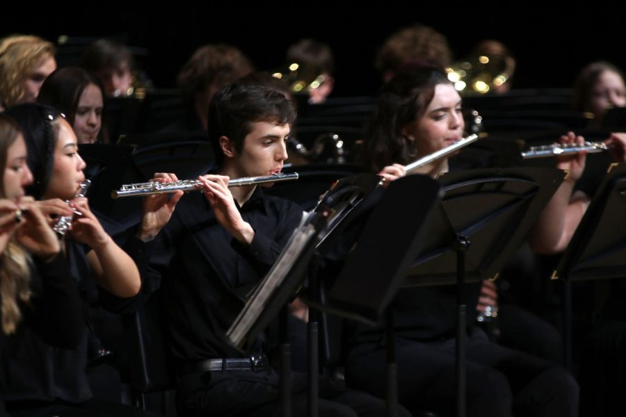 Junior Nathan Anderson plays his flute for the beginning of Emperata Overture.