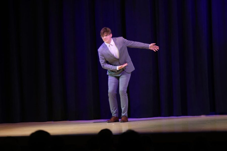 Dressed in his best formal wear, junior Blake Powers bows to the audience.