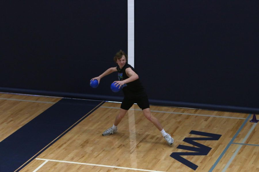Junior Aiden Stroebel throws a dodgeball to get one of his opponents out of the game.