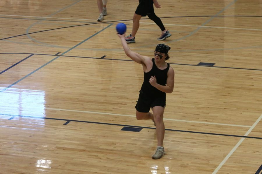 Locating his opponent, junior Ryan Deverill launches a dodgeball.