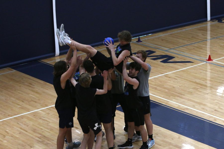 The Weiner Dogs lift junior Aiden Stroebel and chant MVP after winning the tournament.