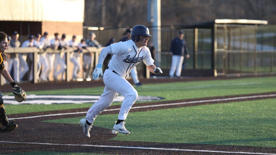 After bunting the ball, junior Reid Livingston starts running to first base. 