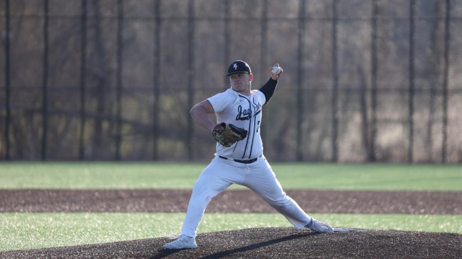 Getting ready to pitch the ball, senior Grant Rutkowski makes a big stride on the pitchers mound.  