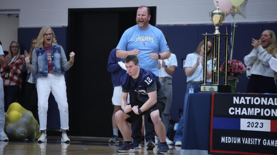 After receiving his special jersey, senior Austin Tomandl shows off his muscles. 