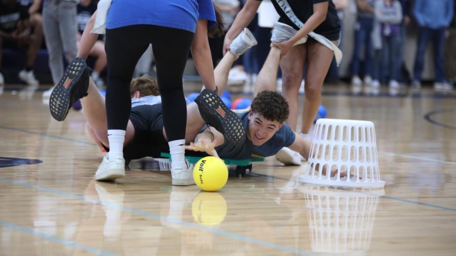 Senior Luke Shideler fights to grab a ball during the Hungry Hungry Hippos game. 