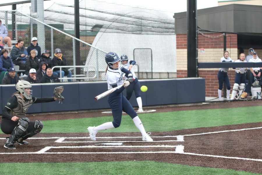 Watching, freshman Kinley Ruder makes contact with the ball.  
