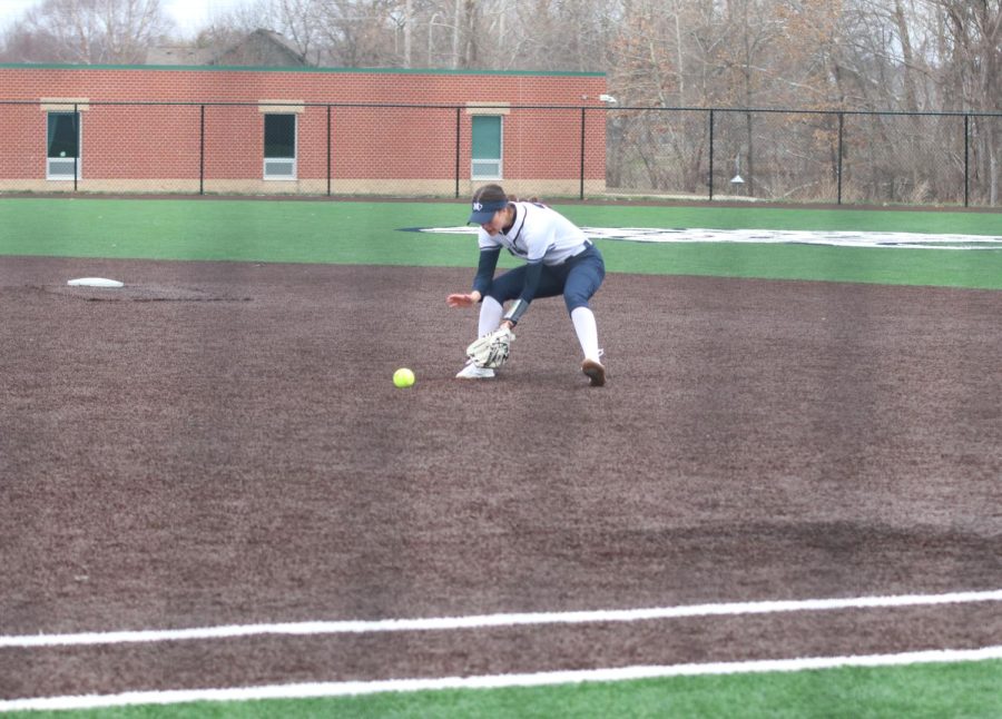  At second base, sophomore Madi Lehr picks up the ground ball. 
