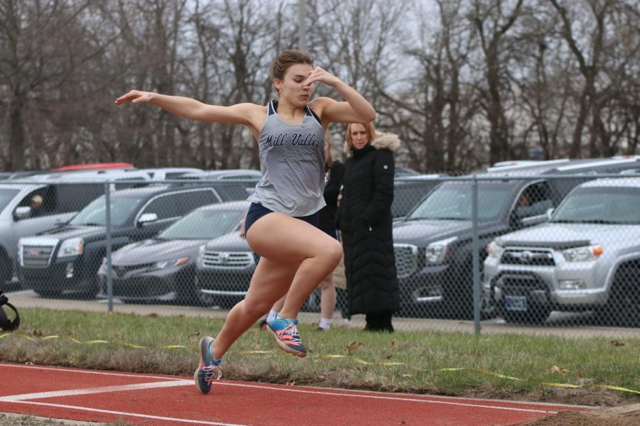 Competing in triple jump, sophomore Josie Mason prepares to jump.