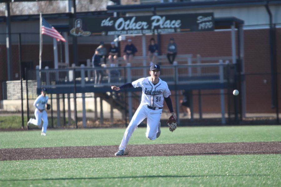 Getting a glimpse of the ball, senior Dylan Blazer runs to catch it.