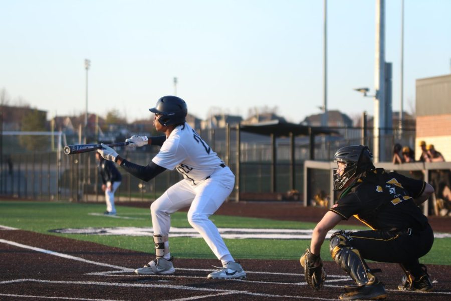 Getting his bat ready, junior Davion Harris gets ready to bunt the ball.