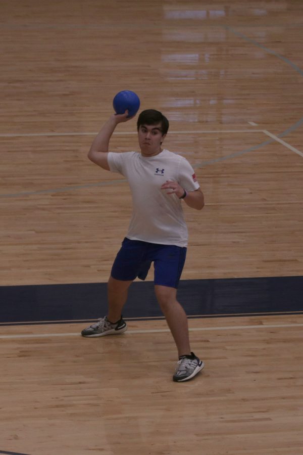 After just throwing his ball, senior Zac Serrano watches it fly to the opposing teams side.