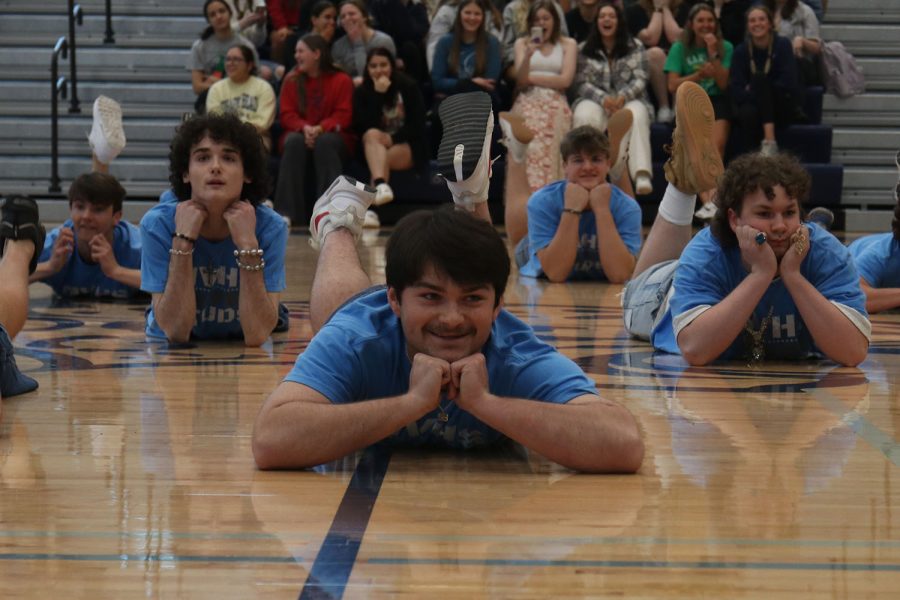 Smiling toward the crowd, senior Parker Volski performs the Silver Stud routine.