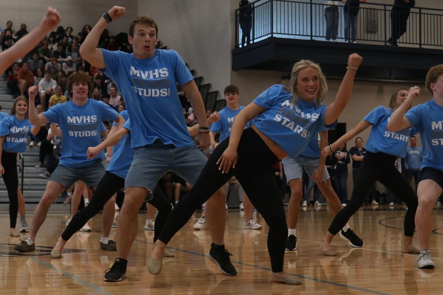 Arms in the air, junior Trinity Baker and senior Hayes Miller look toward the crowd.