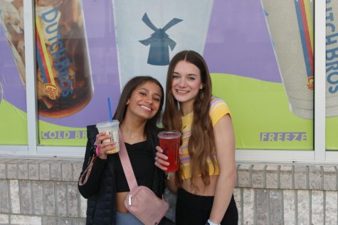 At the local Dutch Bros off of Shawnee Mission Parkway, sophomore Jada Winfrey enjoys her Golden Eagle Chai and sophomore Seville Skinner drinks her Aftershock Red Bull drink Saturday, Feb. 25.