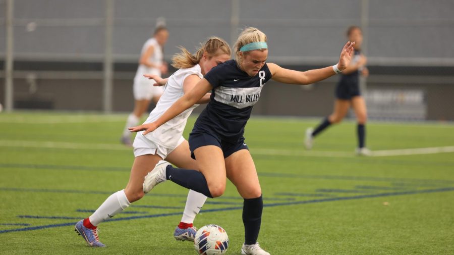 Junior Kate Ricker does a move to get around the defender. 