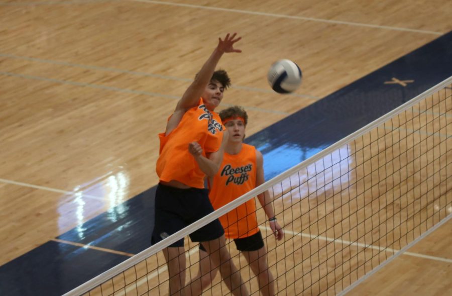 Junior Kenten Laughman jumps in the air, hitting the ball to the other side.