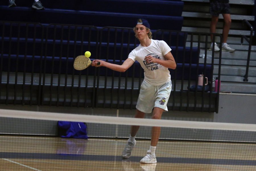 Preparing to hit the ball, freshman Dylan Everheart keeps his eye on the ball.