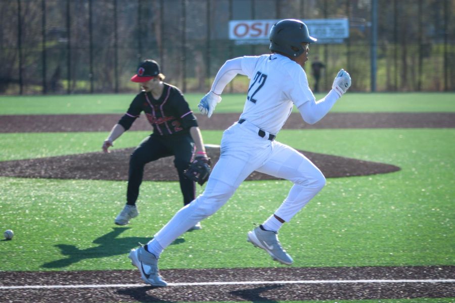 After batting, junior Davion Harris runs to first base Thursday, April 6.