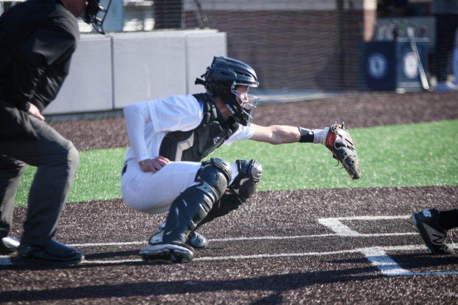 Senior Matt Weis catches the ball, gaining a first out for the other team. 