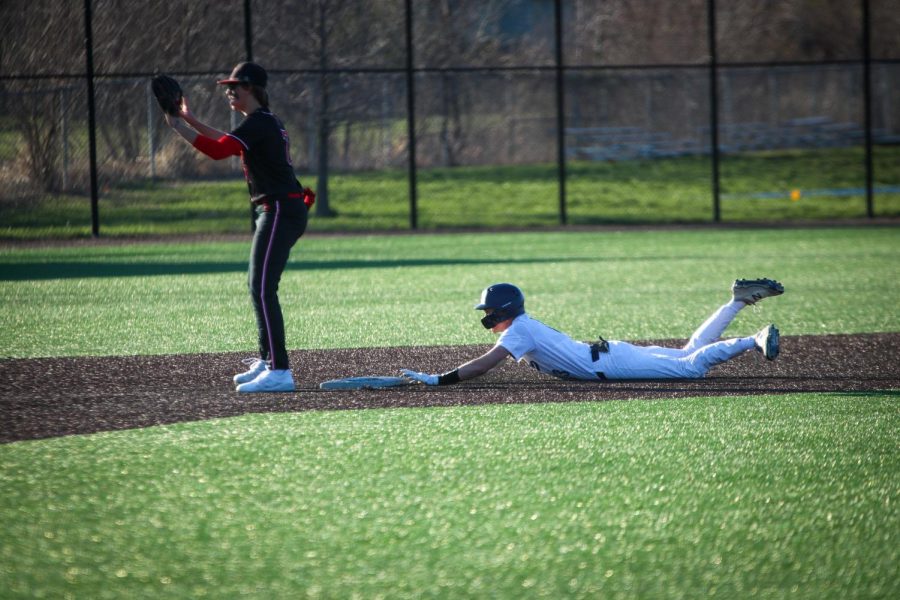 Senior Matt Weis dives toward second base.