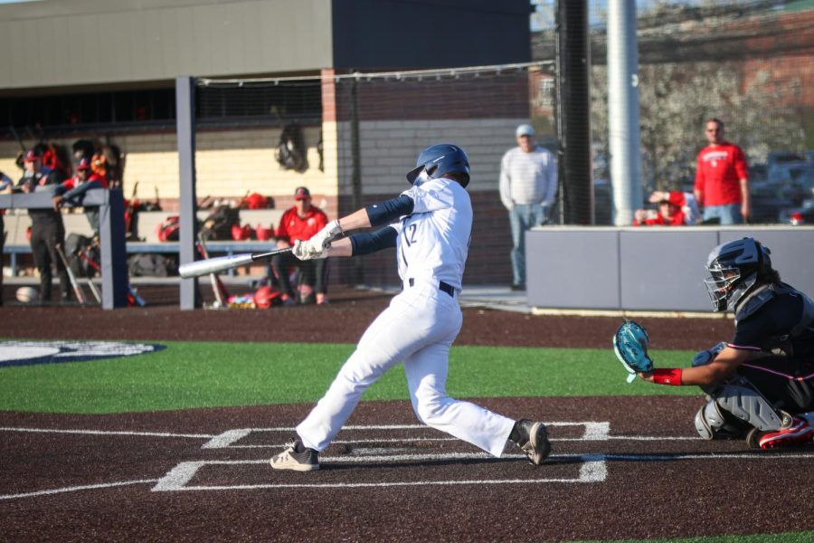 Junior Lucas Longhofer bunts the ball after a harsh pitch.