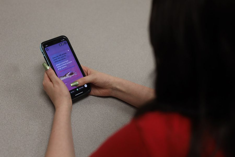 Phone in hand, Sena prepares to repost an infographic that contains info about the correlation between drag queens and child sex abuse.