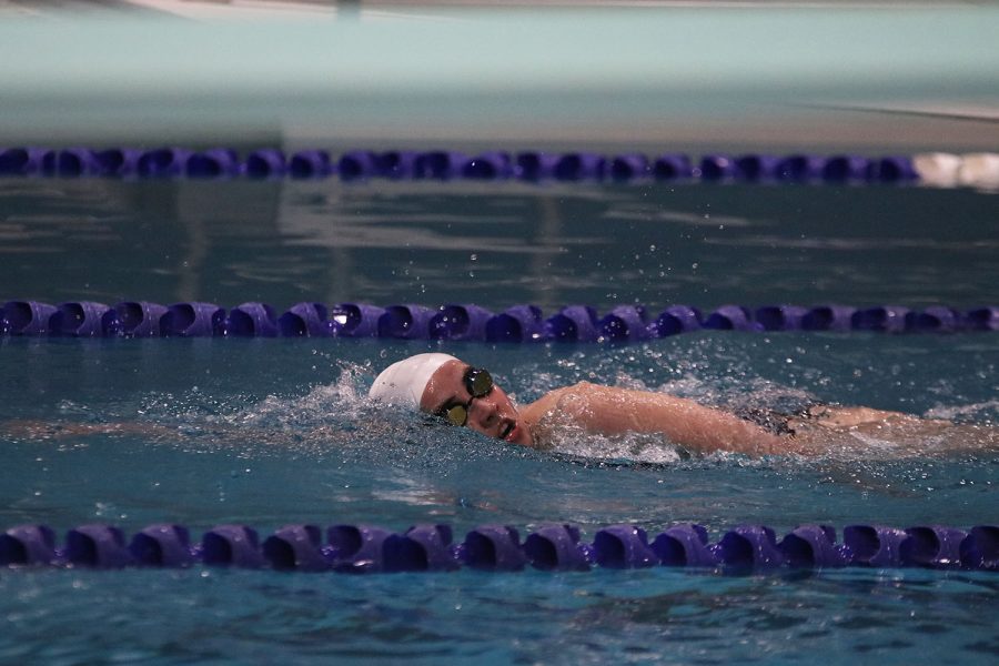 Getting closer to the other end of the pool, freshman Claire Cooper gives it her all. 