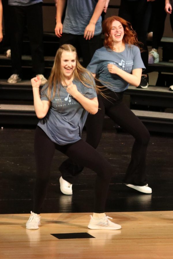 Swinging their arms to the side, juniors Renee Steinle and Ashley Makalous dance to “Little Shop of Horrors” from Little shop of Horrors.
